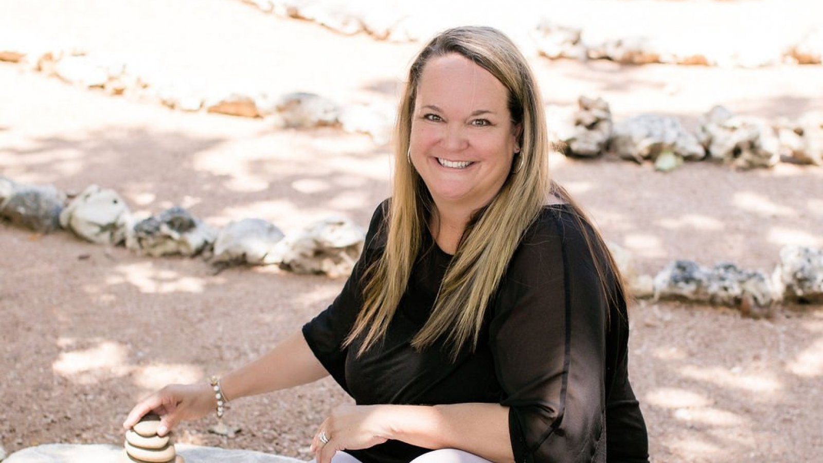 Lori Burdick stacking rocks