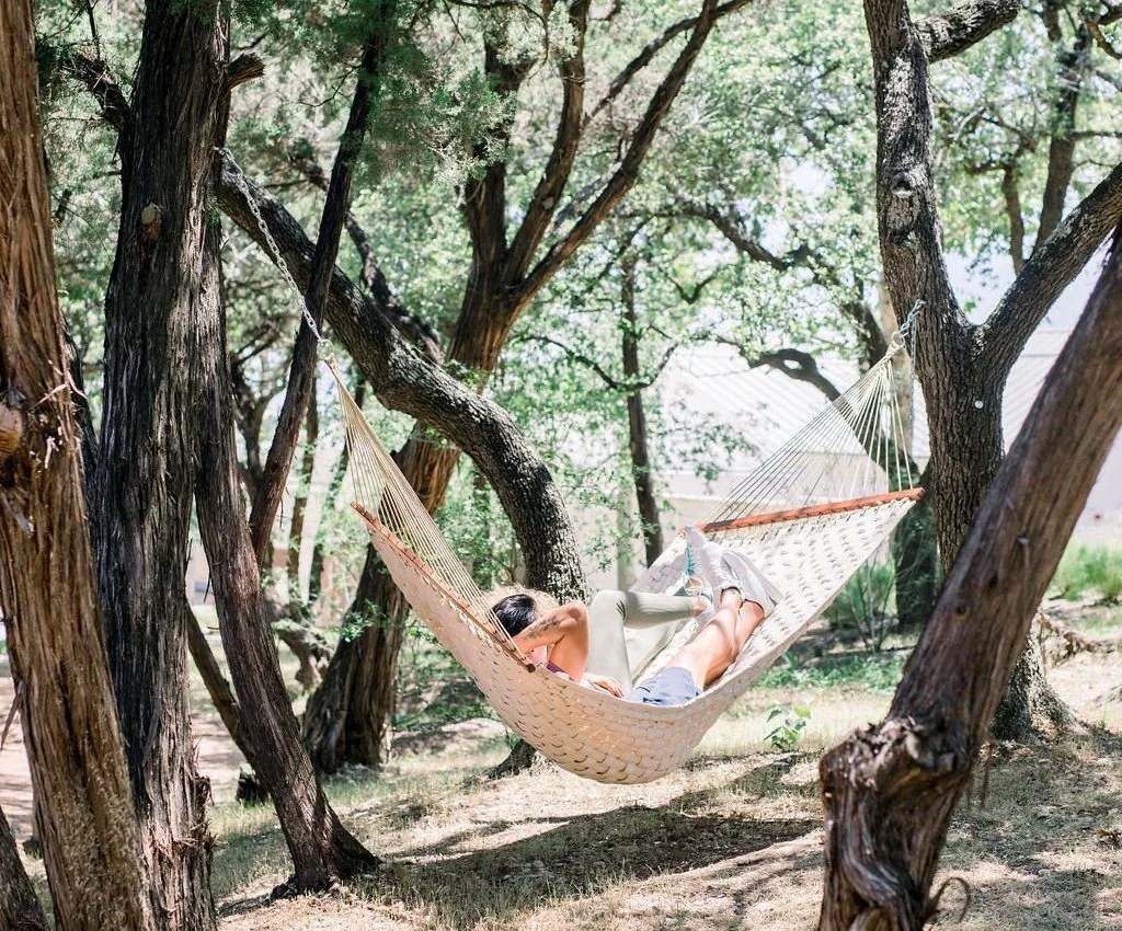 person laying in hammock