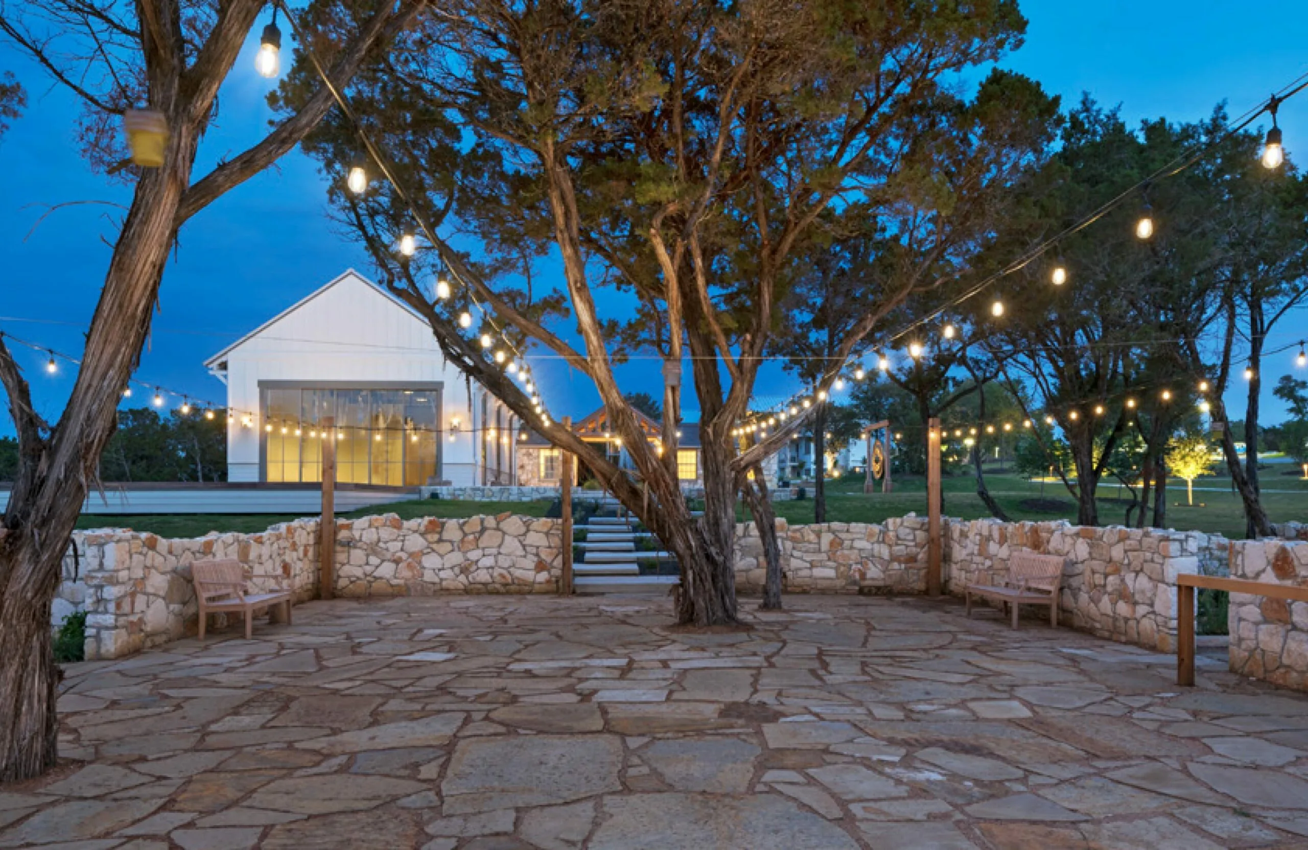outdoor patio area with trees and lights