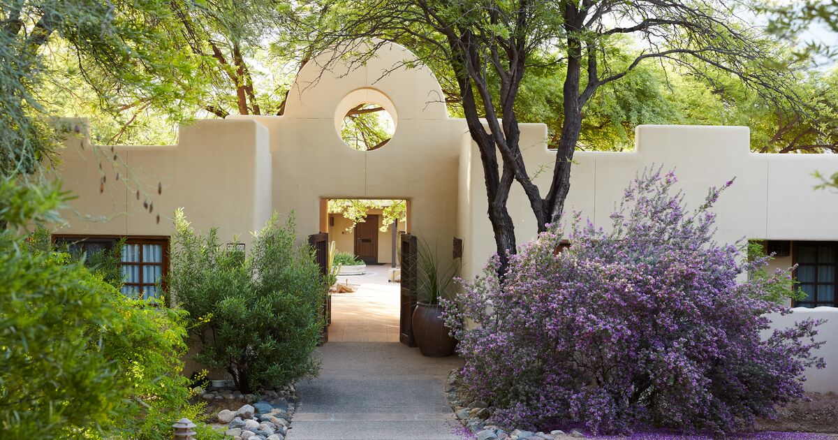 the beautiful entrance to the women’s wellness retreat, featuring a peaceful pathway