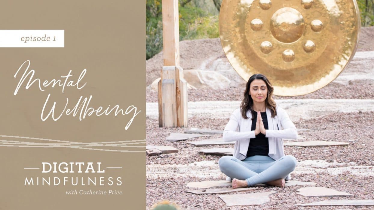 person meditating outside beside a bell