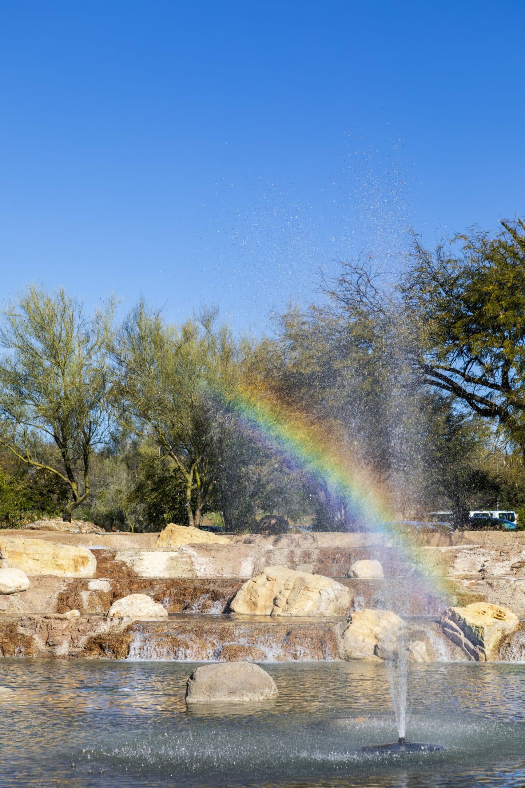 Rainbow reflection over river