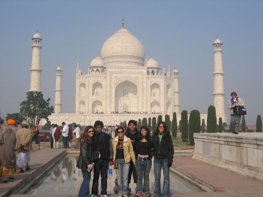 Group photo in front of white temple in India