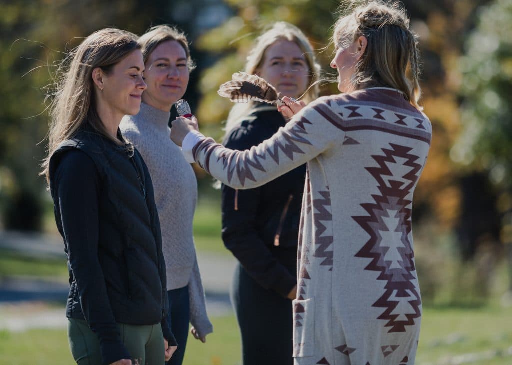Group of women outside with spiritual therapist