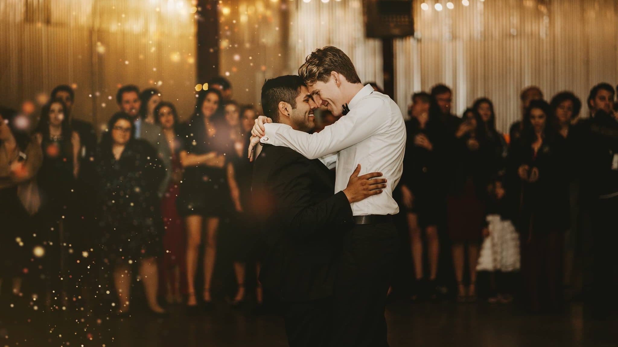 Matthew Coelho and husband getting married, dancing the first dance in front of people